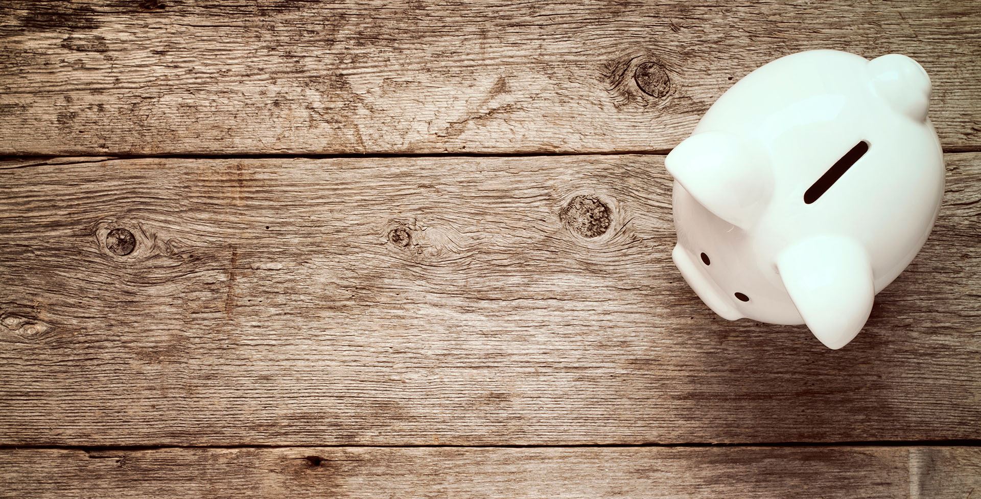 piggy bank on top of a wooden table